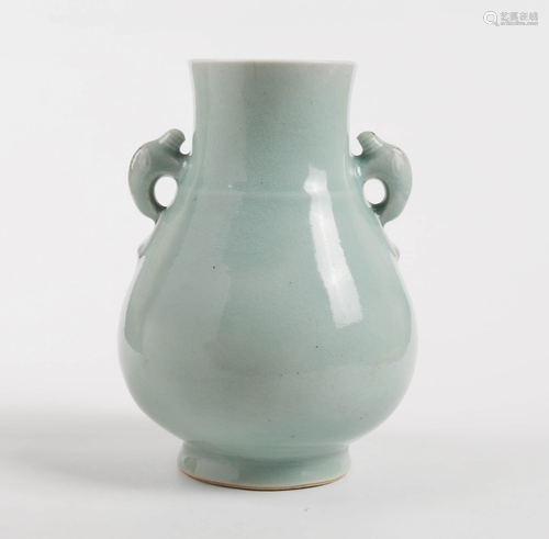 A CHINESE PEA GREEN GLAZED PORCELAIN …