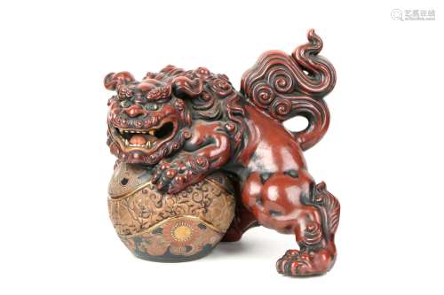a chinese ornament of lion and ball