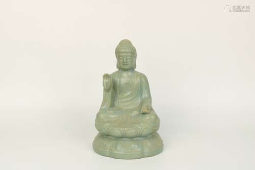 a chinese celadon glazed porcelain buddha statue