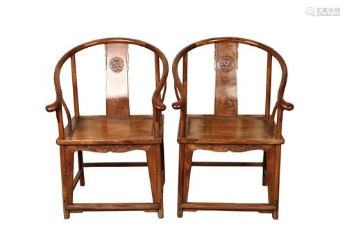 a pair of chinese huanghuali armchairs