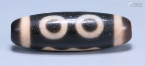 A TIBETAN THREE EYES PATTERN DZI