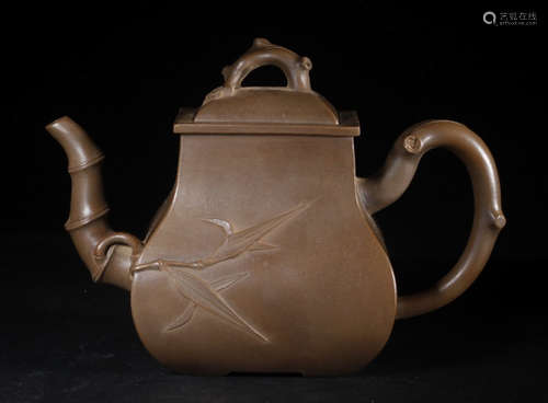 A ZISHA TEA POT CARVED WITH FLOWER PATTERN