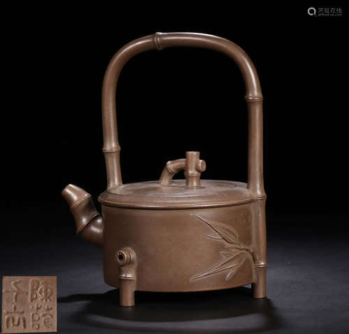 A ZISHA TEA POT CARVED WITH BAMBOO PATTERN