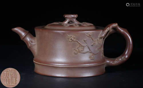 A ZISHA TEA POT CARVED WITH PLUM FLOWER