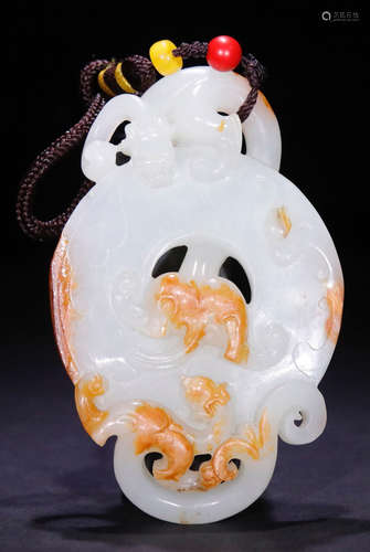 A HETIAN JADE PENDANT CARVED WITH BEAST