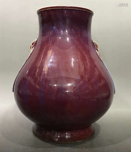 A RED GLAZE VASE WITH EARS