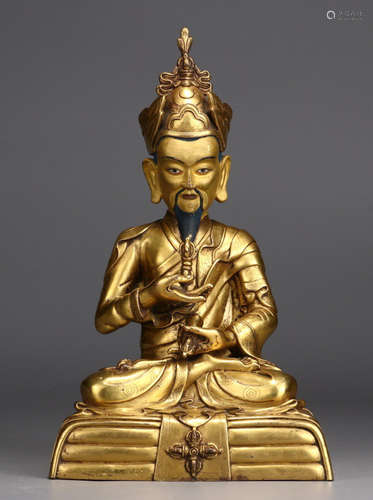 A GILT BRONZE FIGURE STATUE