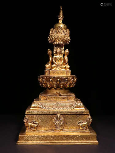 A GILT BRONZE PAGODA CARVED WITH BUDDHA