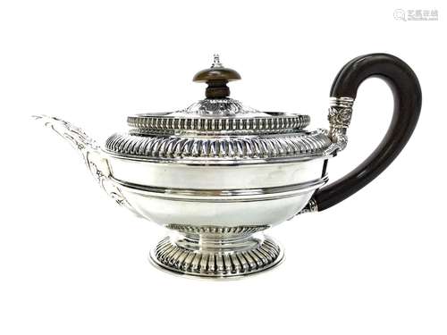 A LATE VICTORIAN SILVER TEA POT