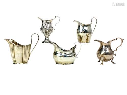 A LOT OF FIVE SILVER CREAM JUGS