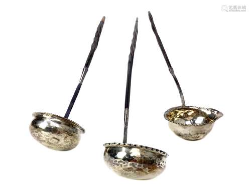 A LOT OF THREE GEORGIAN SILVER TODDY LADLES