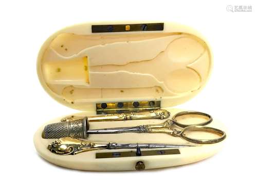 A LATE 19TH CENTURY FRENCH IVORY CASED SEWING KIT