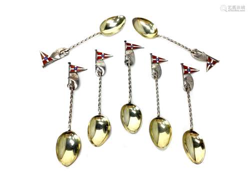 A SET OF SEVEN ENAMELLED SILVER TEASPOONS