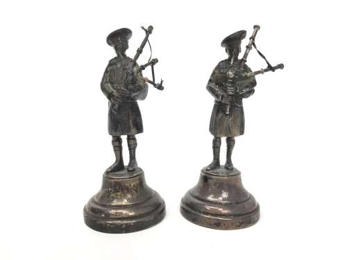 A PAIR OF SILVER FIGURES OF BAGPIPERS