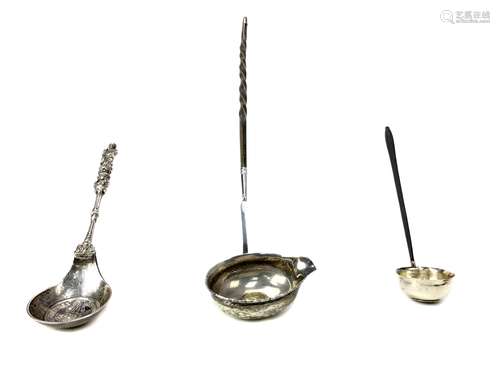 A CONTINENTAL SILVER APOSTLE SPOON ALONG WITH TWO TODDY LADLES