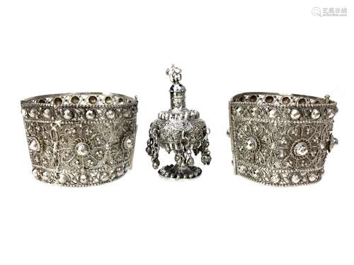 A PAIR OF INDIAN SILVER CUFFS AND A SPRINKLER/PERFUME BOTTLE