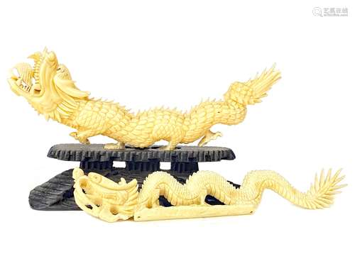 A LOT OF TWO EARLY 20TH CENTURY CHINESE IVORY CARVINGS OF A DRAGONS