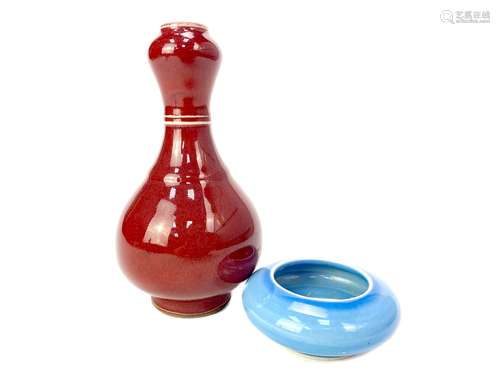 A CHINESE SANG DE BOEUF VASE AND A PALE BLUE CIRCULAR DISH