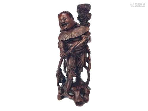 A CHINESE CARVED ROOTWOOD FIGURE