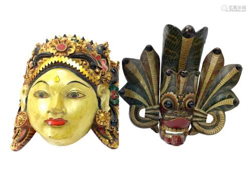 A LOT OF TWO CARVED WALL MASKS
