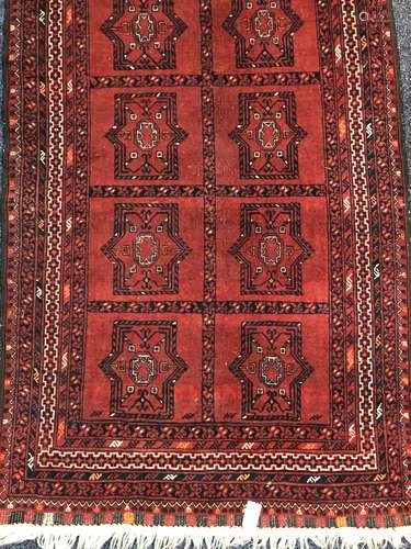 A 20TH CENTURY AFGHAN BOKHARA RUG