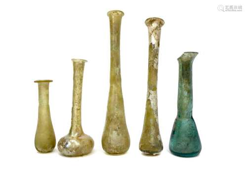 A LOT OF THREE ROMAN GLASS PERFUME BOTTLES AND TWO OTHERS