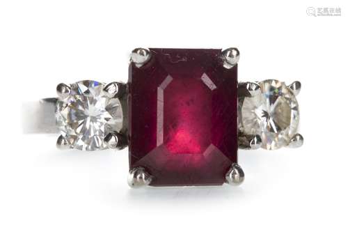 A RED GEM SET AND MOISSANITE THREE STONE RING