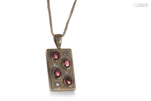 A RED GEM SET AND DIAMOND PENDANT