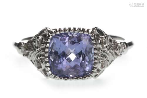 A TANZANITE AND DIAMOND RING