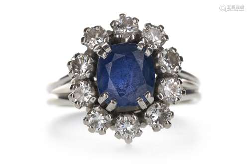 A BLUE GEM SET AND DIAMOND CLUSTER RING