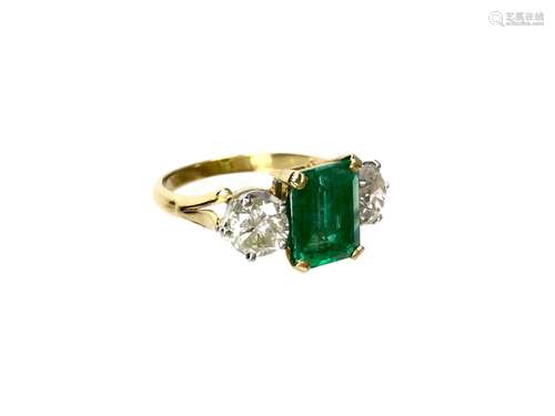 A GREEN GEM AND DIAMOND THREE STONE RING