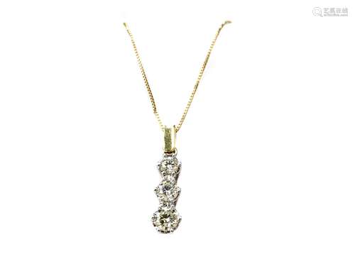 A DIAMOND THREE STONE PENDANT ON CHAIN