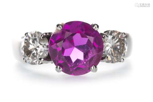 A PINK GEM SET AND DIAMOND THREE STONE RING