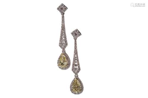 A PAIR OF GIA CERTIFICATED FANCY YELLOW DIAMOND EARRINGS