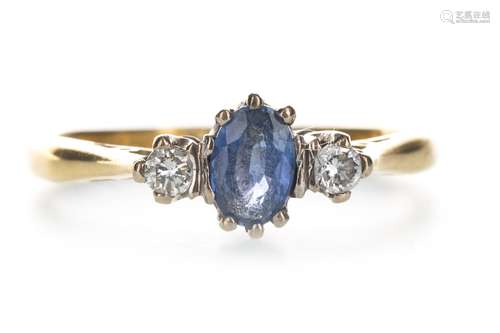 A BLUE GEM SET AND DIAMOND THREE STONE RING