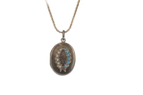 A GOLD CHAIN WITH SPHERICAL BALLS AND A GEM SET LOCKET