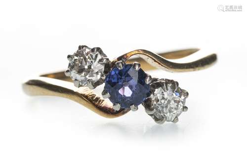 A BLUE GEM SET AND DIAMOND THREE STONE RING