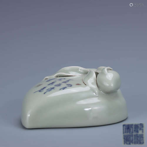 A Chinese Pea Green Glazed Blue and White Inscribed Porcelain Paper Weight
