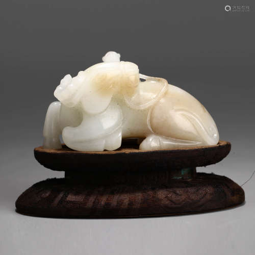 A Chinese White Jade Carved Ox Ornament