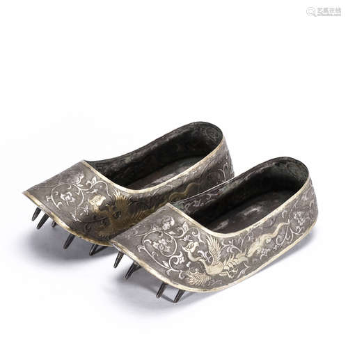 A pair of silver gilt shoes with flowers pattern