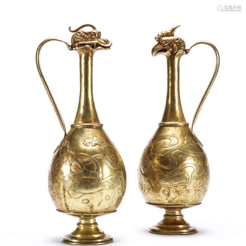 A pair of gilt copper fei tian pattern dragon head and pheonix head pots