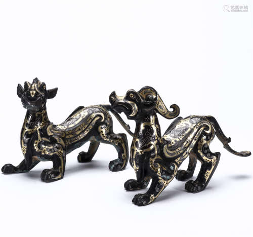 A pair of bronze gold and silver auspicious beasts