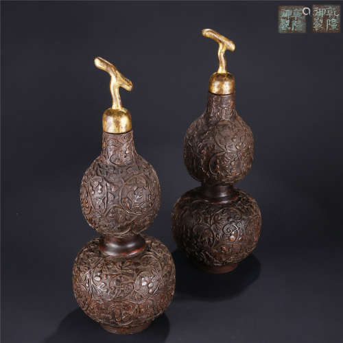 A pair of chen xiang wood carved flower pattern gourd bottles