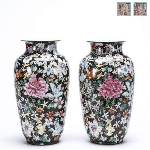 A pair of black ground flower drawing with gold edge porcelain bottles