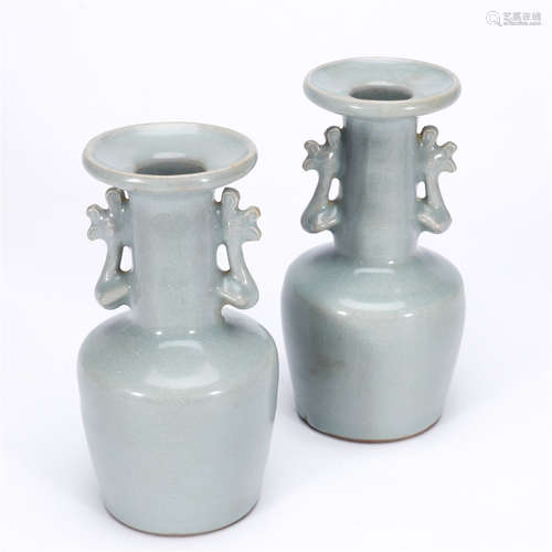 A pair of green glaze double pheonix ears porcelain vases