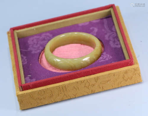 A HETIAN YELLOW JADE BANGLE CARVED WITH DRAGON