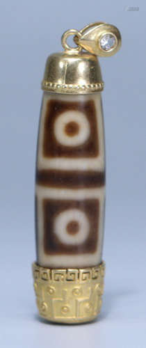 A FOUR EYES PATTERN DZI EMBEDDED WITH GOLD