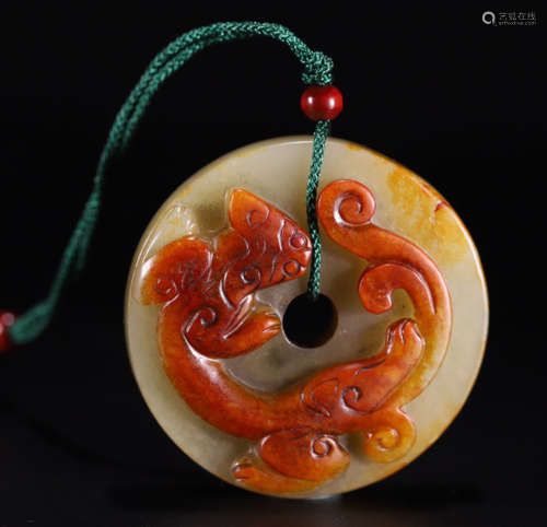 AN OLD HETIAN JADE PENDANT CARVED WITH DRAGON