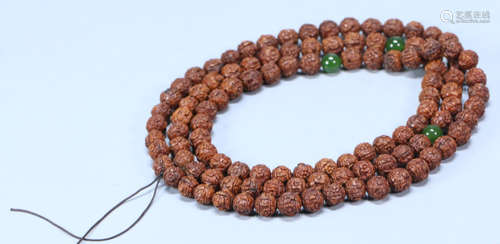 AN OLD WALNUT STRING NECKLACE WITH 108 BEADS