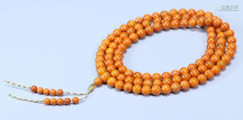 AN OLD BEESWAX STRING NECKLACE WITH 108 BEADS